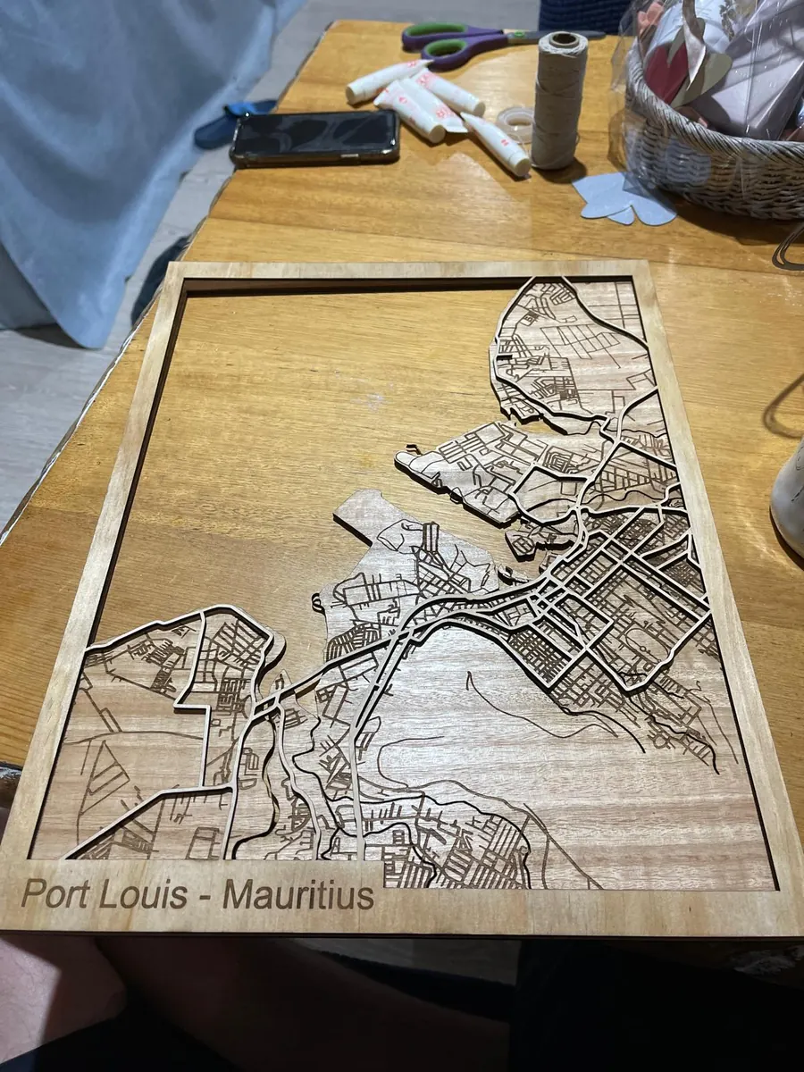 Unframed laser cut map of Port Louis, Mauritius showing the stacked timber layers and engraved street detail