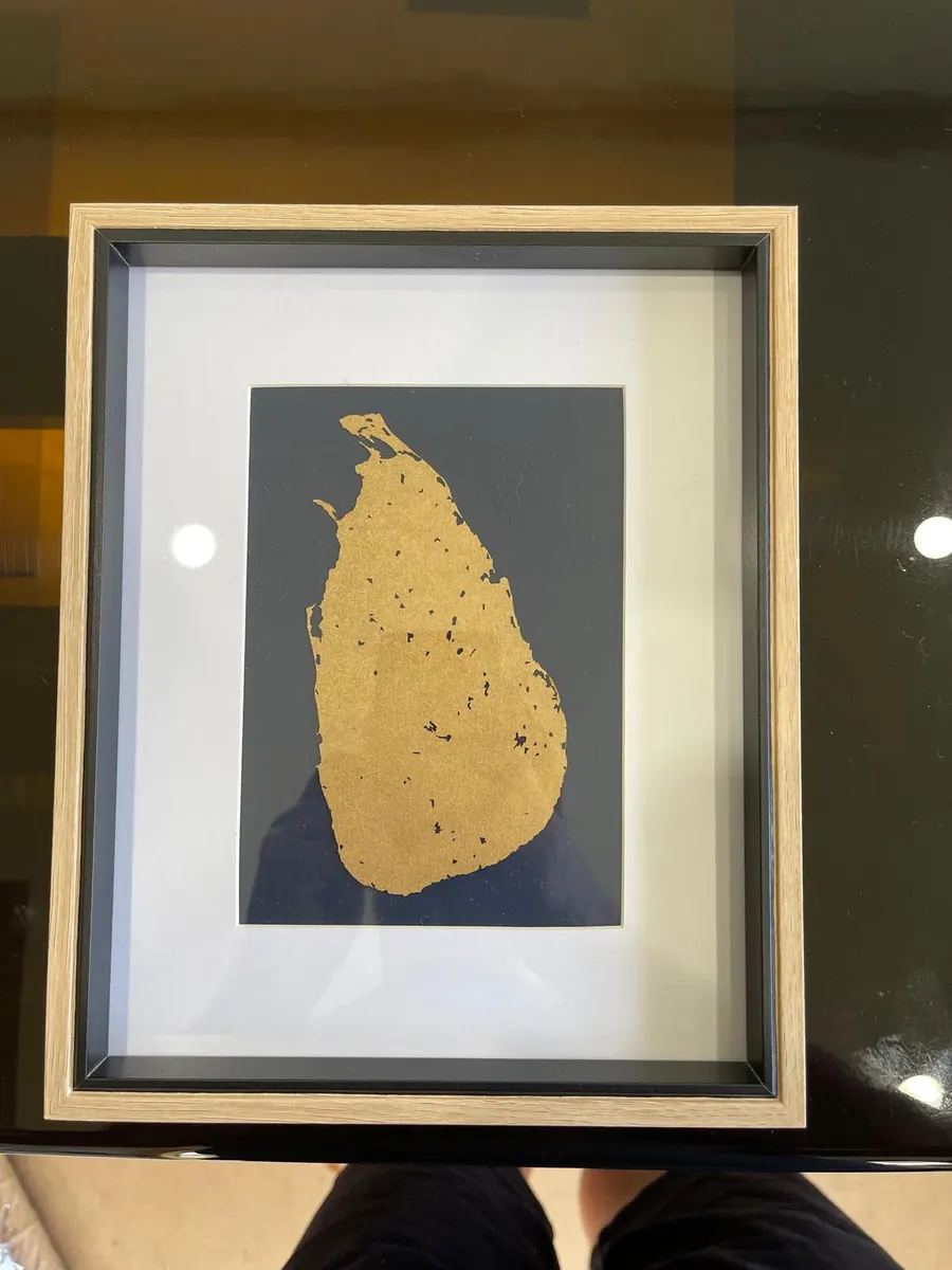 Framed laser cut silhouette map of Sri Lanka in gold mounted on charcoal card in a shadow box frame